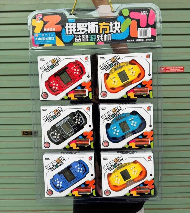 Đồ chơi - Hộp máy chơi game cầm tay nhiều màu cho bé (Kiện 100 cái) 2