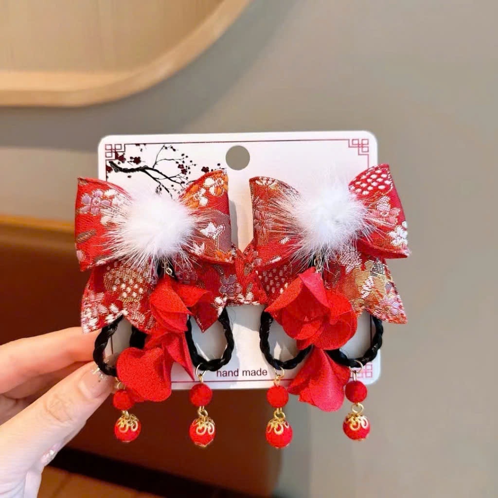 Set 2 kẹp tóc hoa đỏ tua rua