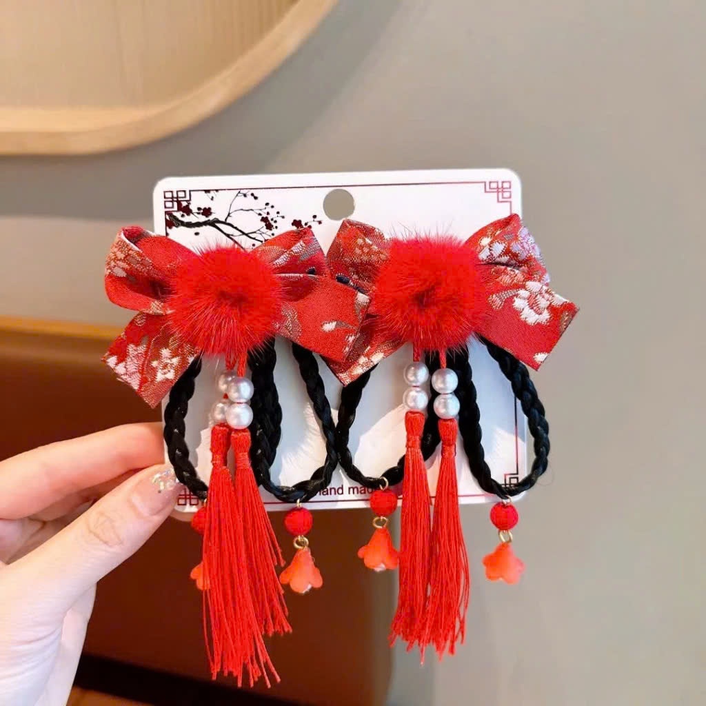 Set 2 kẹp tóc hoa đỏ tua rua
