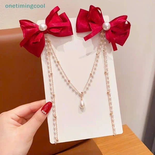 set 2 Kẹp tóc nơ đỏ phối dài dây ngọc