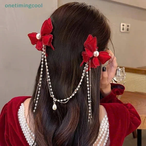 set 2 Kẹp tóc nơ đỏ phối dài dây ngọc