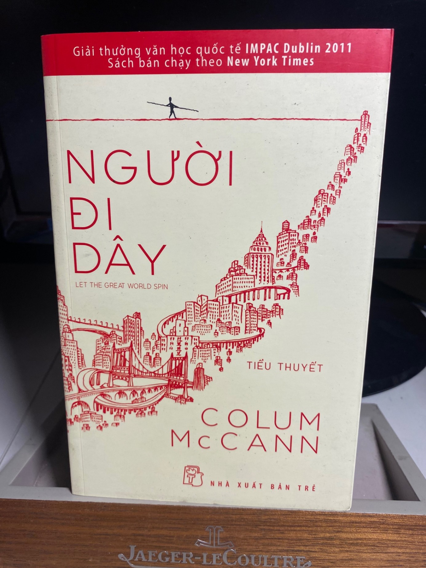 Người đi dây -Tác giả: Colum McCann - NXB Trẻ 2014- Sách lưu kho có ố nhẹ cạnh sách STB412
