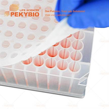 A hand holding a plastic container with red liquid  AI-generated content may be incorrect.