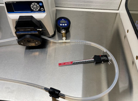 A pipe with a gauge on a table  AI-generated content may be incorrect.