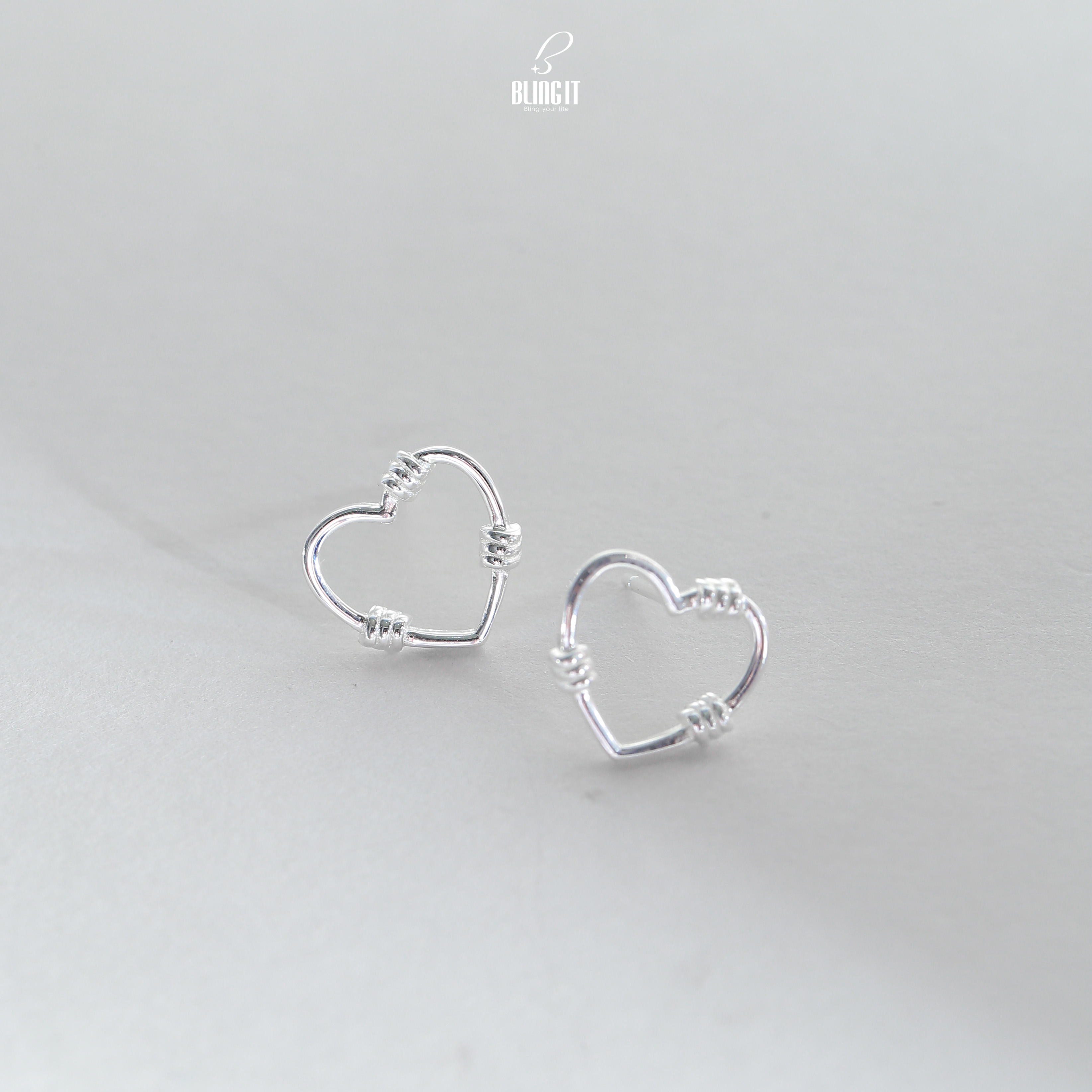 X - Twist heart earring bibt601