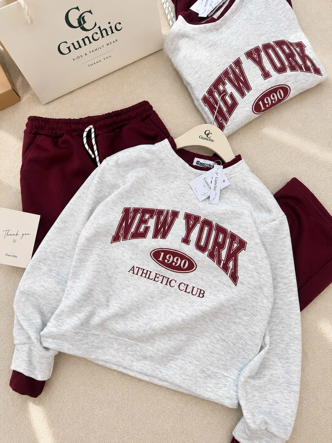S426 - BỘ NỮ NỈ HAIDA ÁO GHI NEWYORK QUẦN SUÔNG ĐỎ
