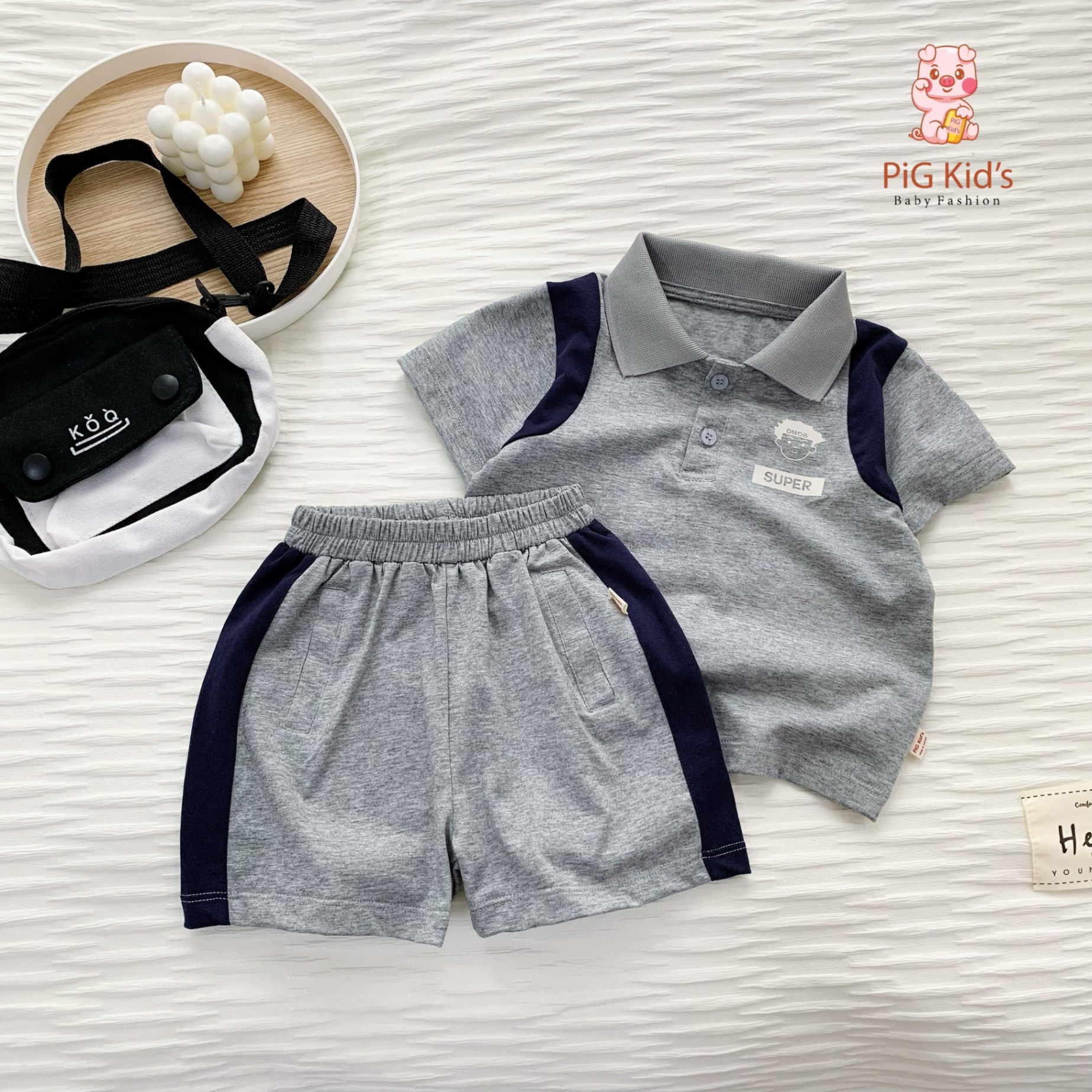Bộ polo cotton cộc tay phối màu họa tiết in xinh xắn Pig Kid cho bé