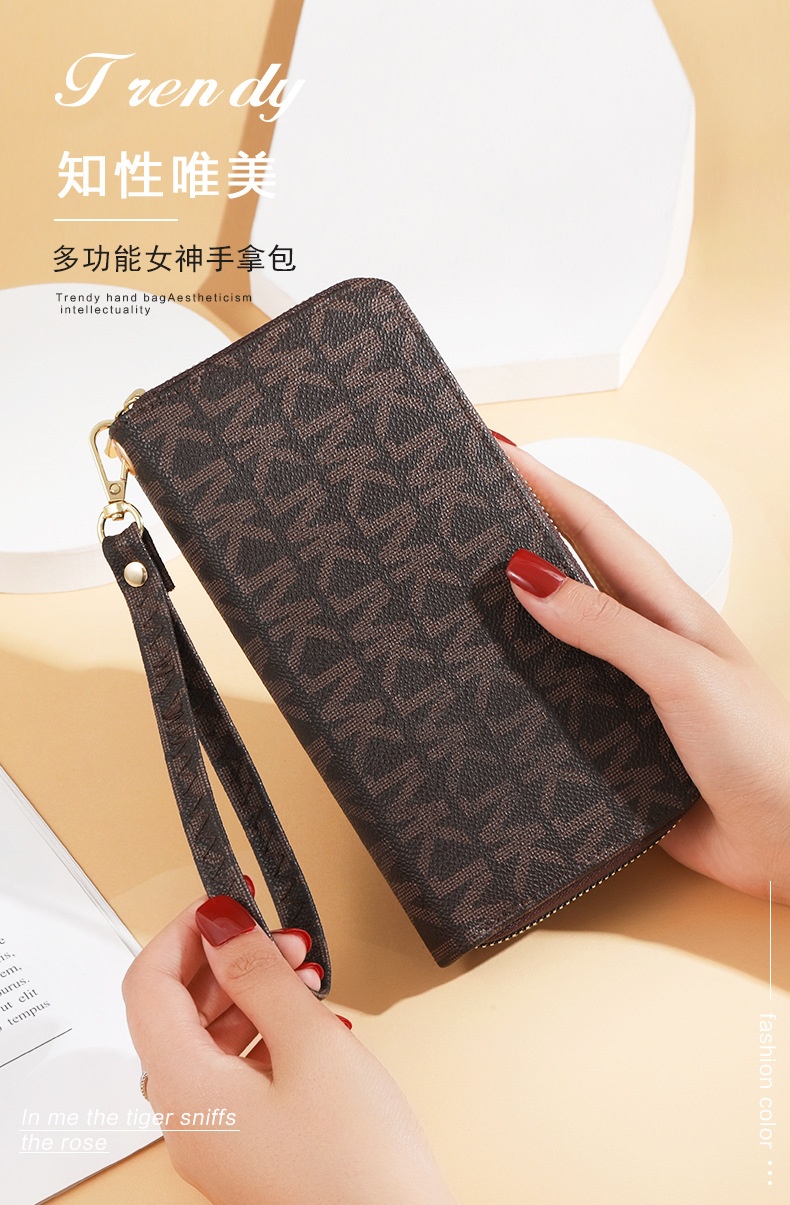 24HA216.23 - VÍ NỮ CẦM TAY MK