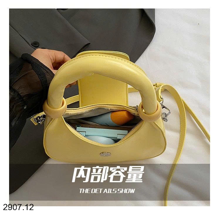 25HA2907.12 - TÚI XÁCH CẦM TAY HÌNH LƯỠI LIỀM