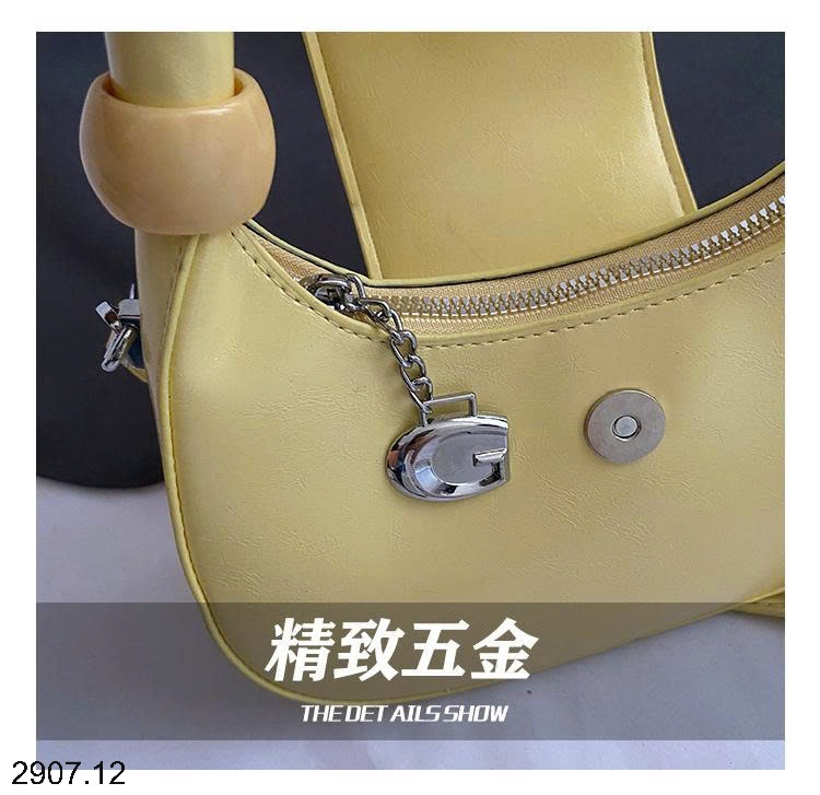 25HA2907.12 - TÚI XÁCH CẦM TAY HÌNH LƯỠI LIỀM