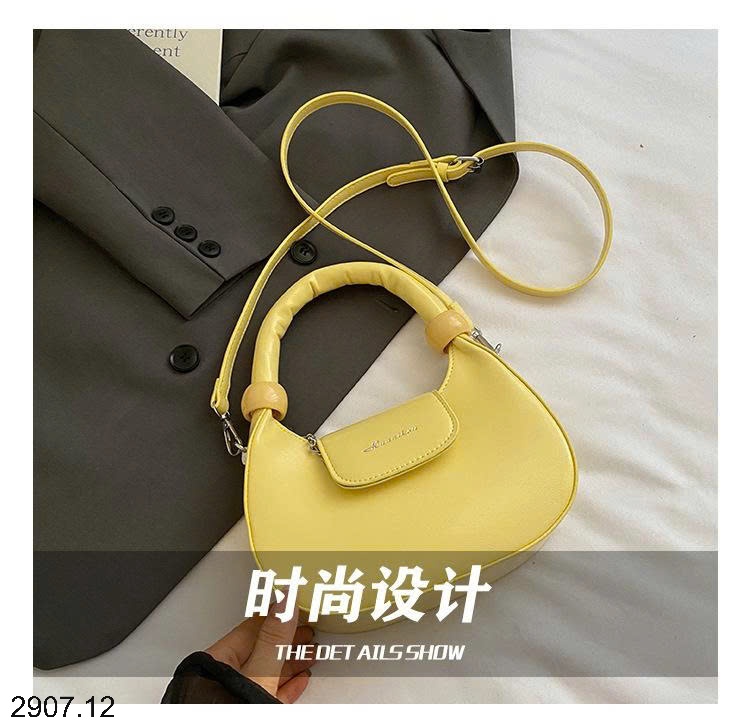 25HA2907.12 - TÚI XÁCH CẦM TAY HÌNH LƯỠI LIỀM