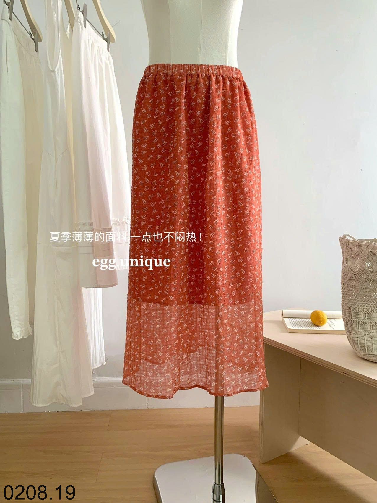 26HA0208.19 - CHÂN VÁY HOA MÀU CAM EGG