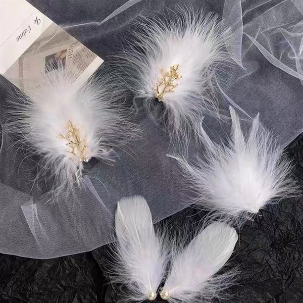 SALE OFF KẸP LÔNG VŨ TRẮNG 007