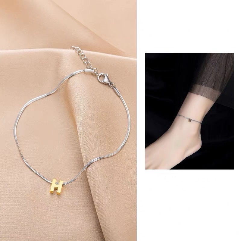 Lắc chân titan chữ H nhỏ 1018