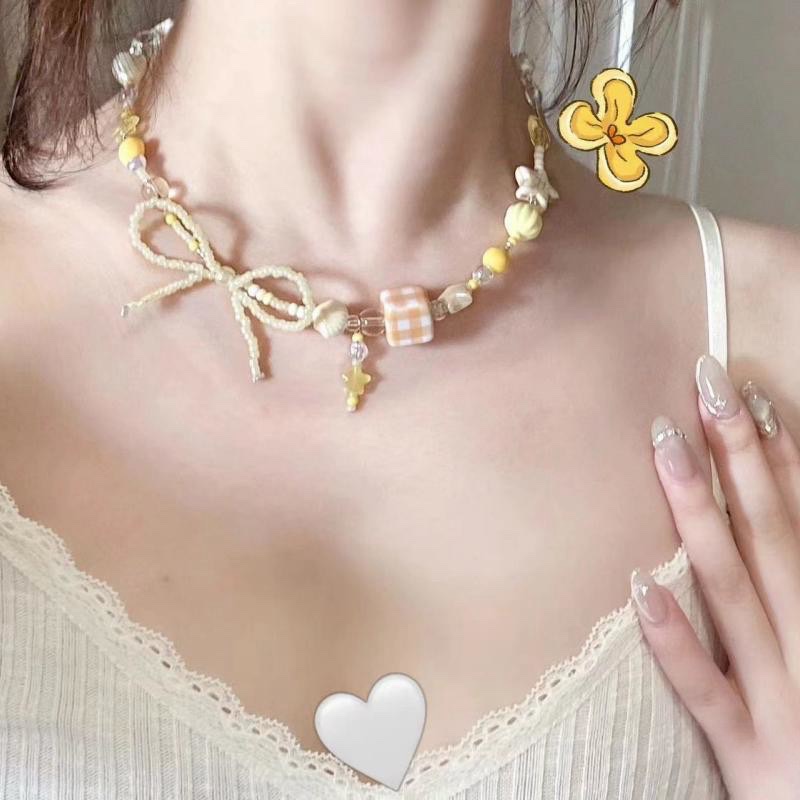 Vòng cổ hạt màu vàng nơ 975