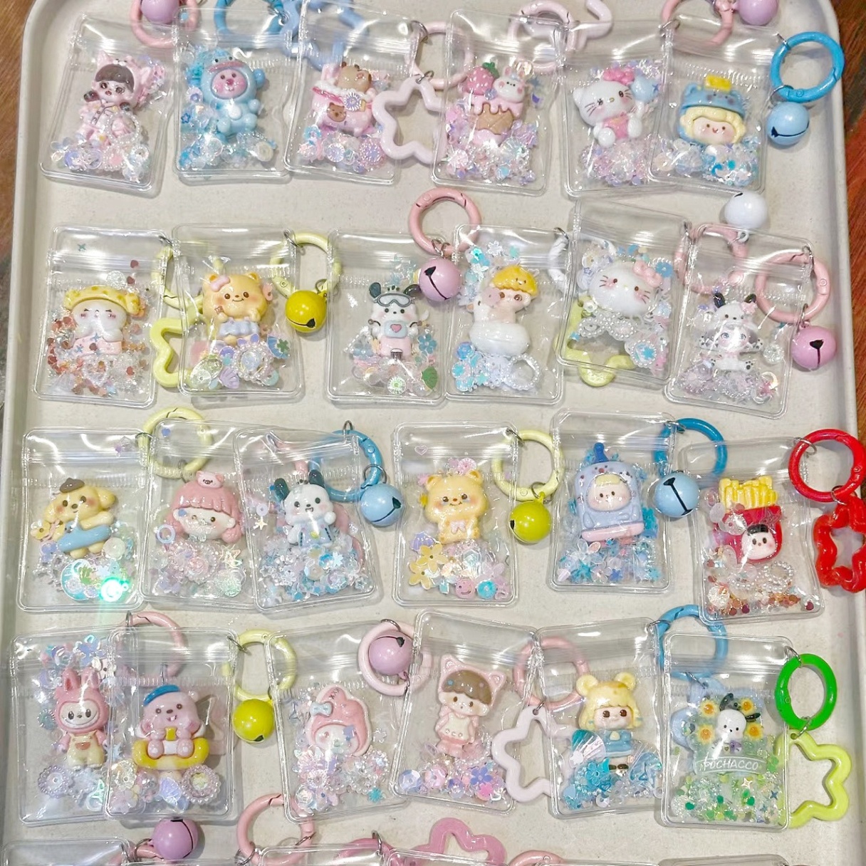 Móc khoá túi nhựa charm kim tuyến 987
