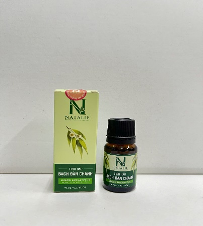 A small bottle of essential oil next to a box  Description automatically generated