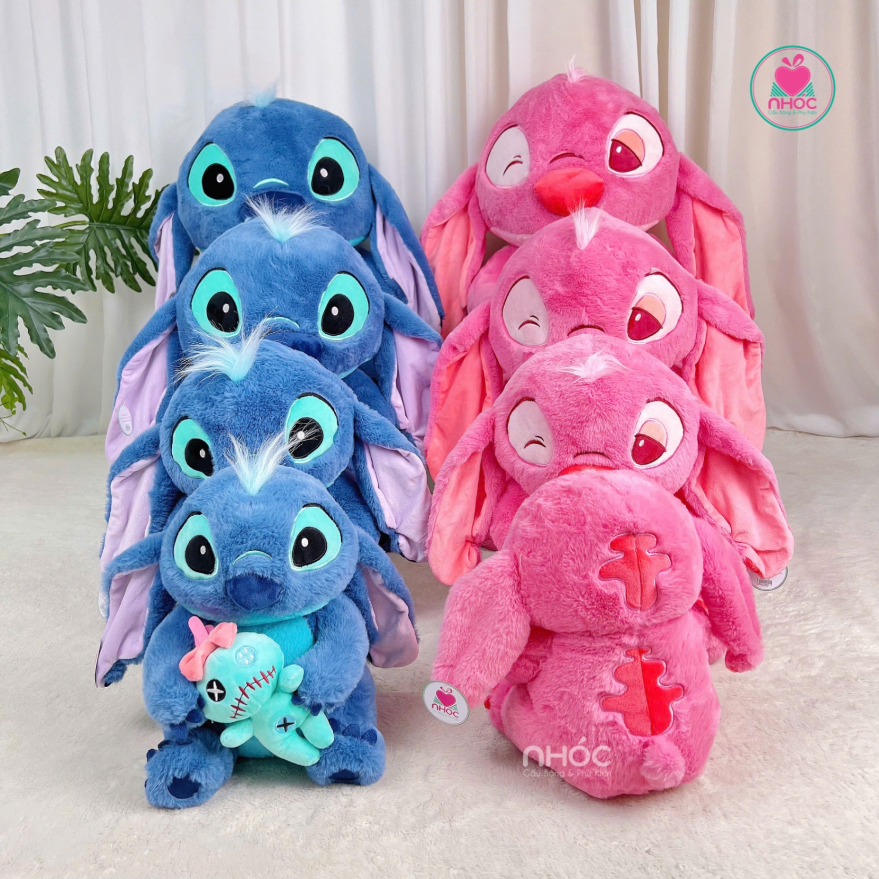 Thú bông Stitch ôm búp bê ngồi lông xù