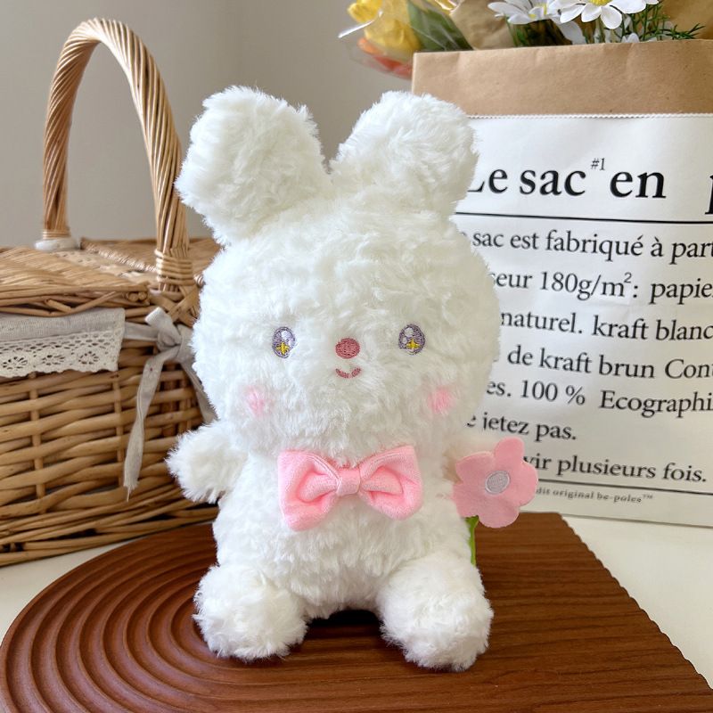 Động vật bông đeo nơ cầm hoa (20cm)