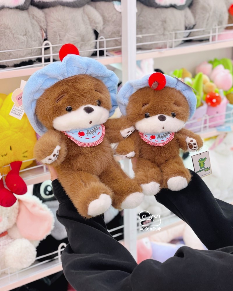 Gấu bông đeo băng đô xanh
