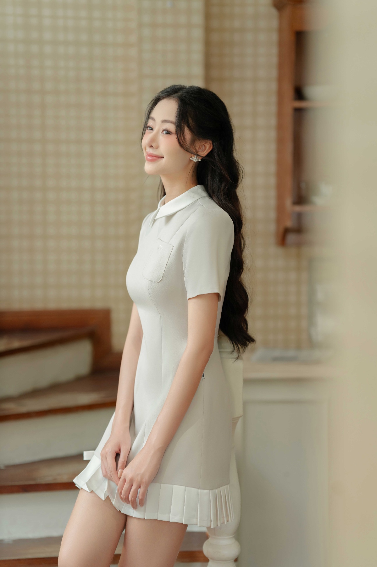 Đầm cổ đức chân xếp ly túi nơ ngực