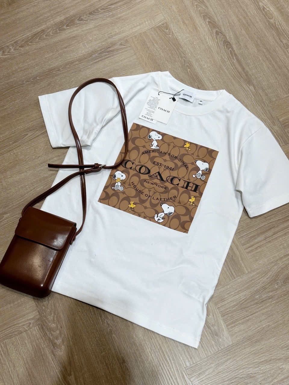 ÁO PULL CỘC COACH PHỐI NÂU HÌNH CÚN