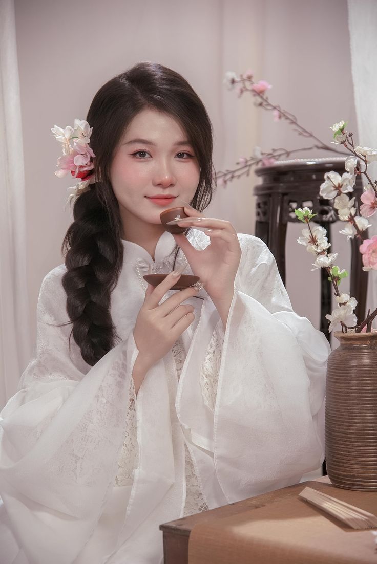 Phông chụp ảnh tết màu hồng phớt cũng được ưa chuộng trong mỗi dịp Tết đến xuân về