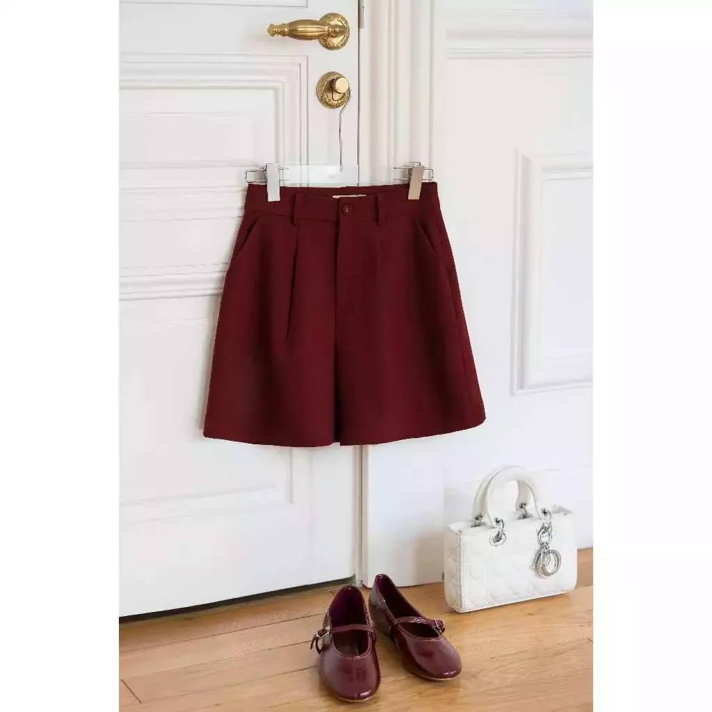 Quần short túi chéo cúc bọc mắt cáo