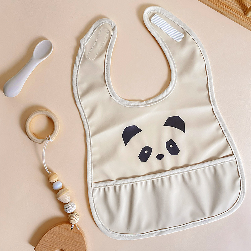 Yếm ăn dặm cho bé có máng hứng phong cách Hàn Quốc chất liệu da PU chống thấm nước, dễ giặt, hoạ tiết dễ thương