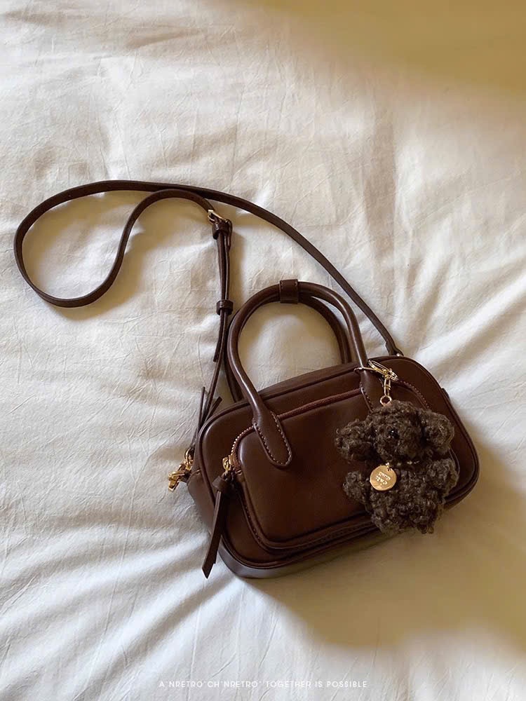 M6769 - TÚI TRỐNG CHIO’2ND MÀU NÂU KÈM CHARM CÚN