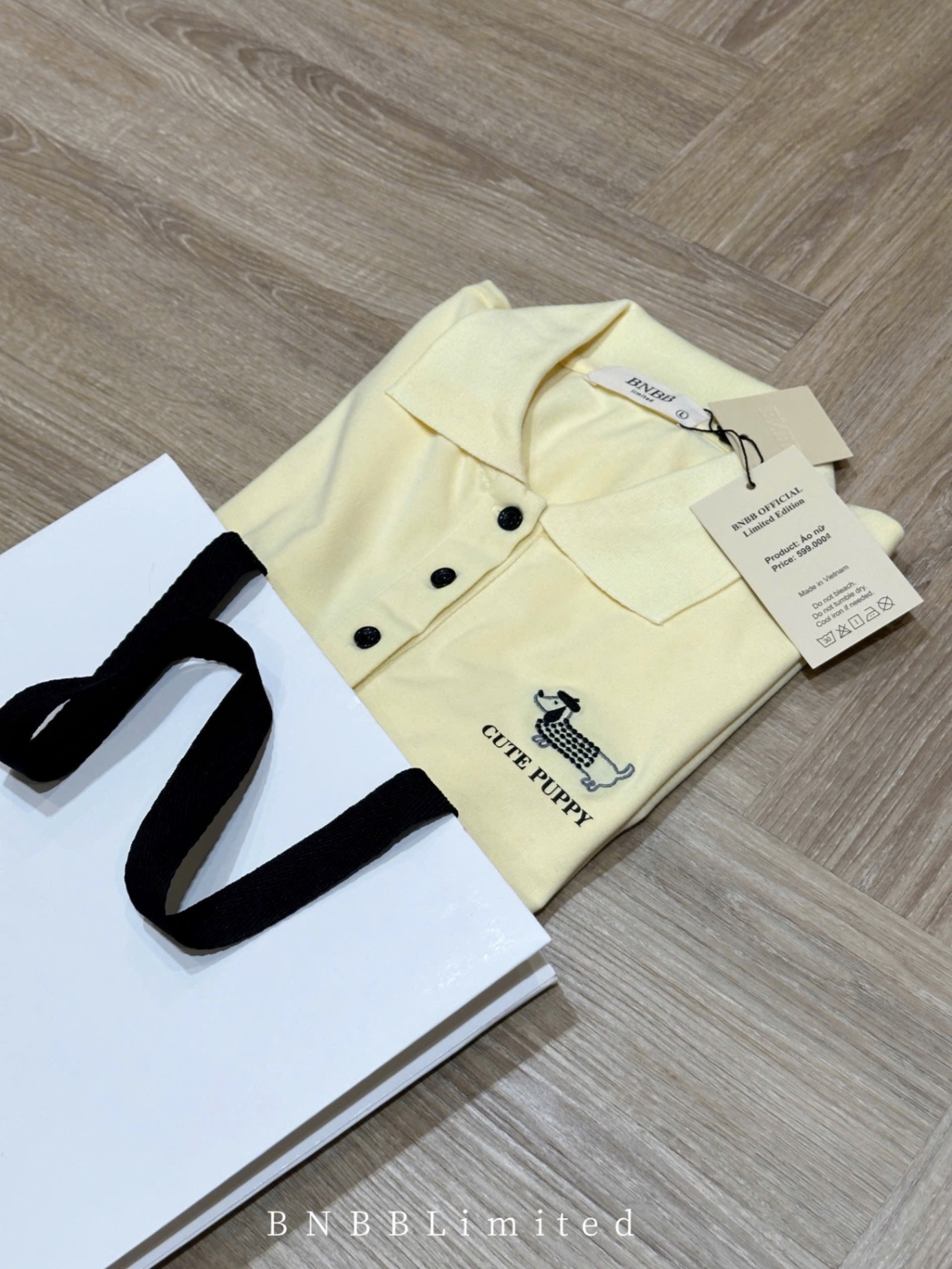 ÁO POLO CỘC VÀNG THÊU CÚN BNBB