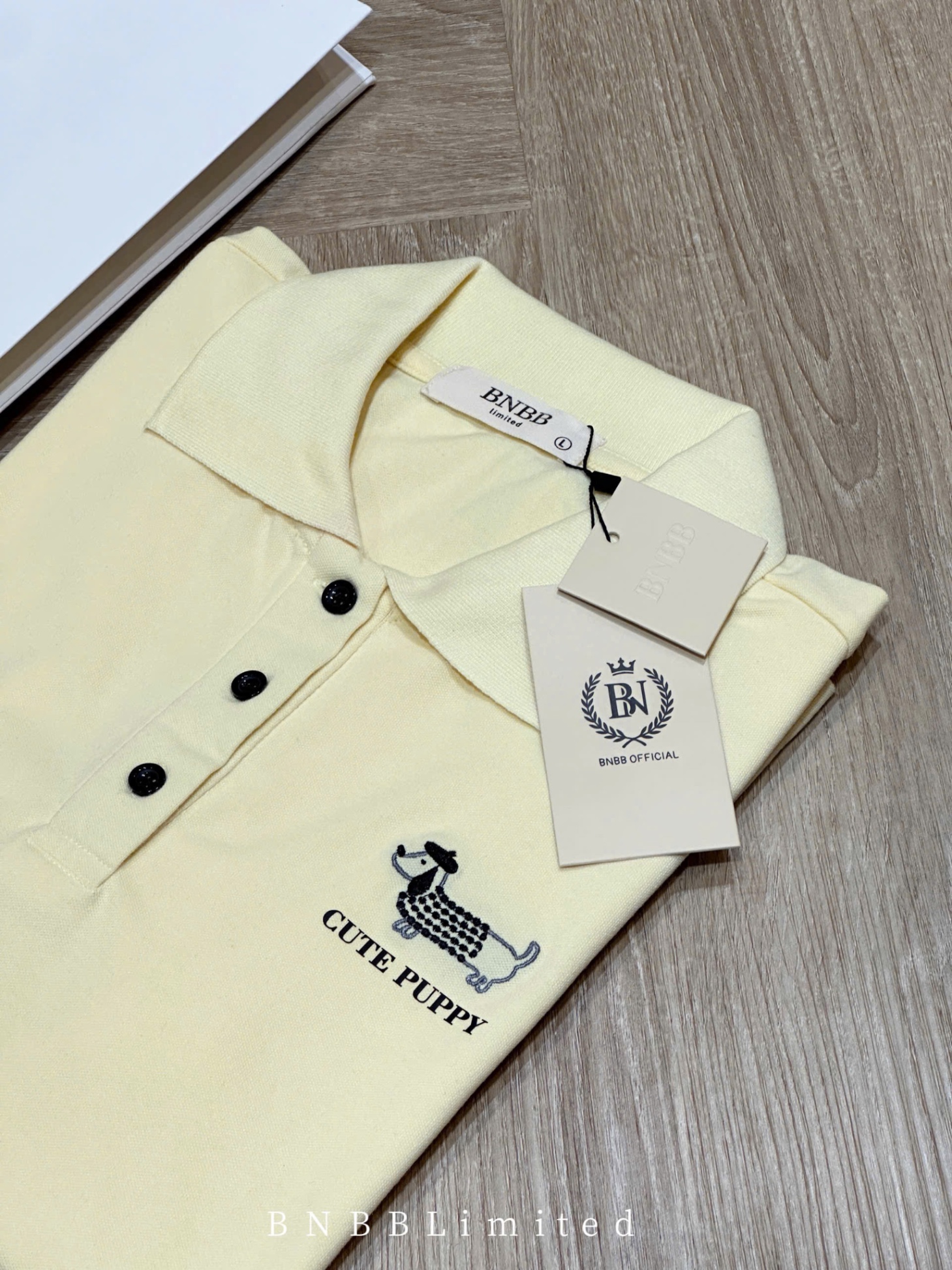 ÁO POLO CỘC VÀNG THÊU CÚN BNBB
