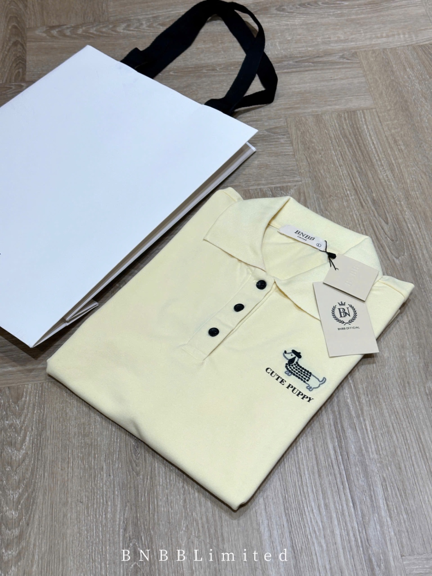 ÁO POLO CỘC VÀNG THÊU CÚN BNBB