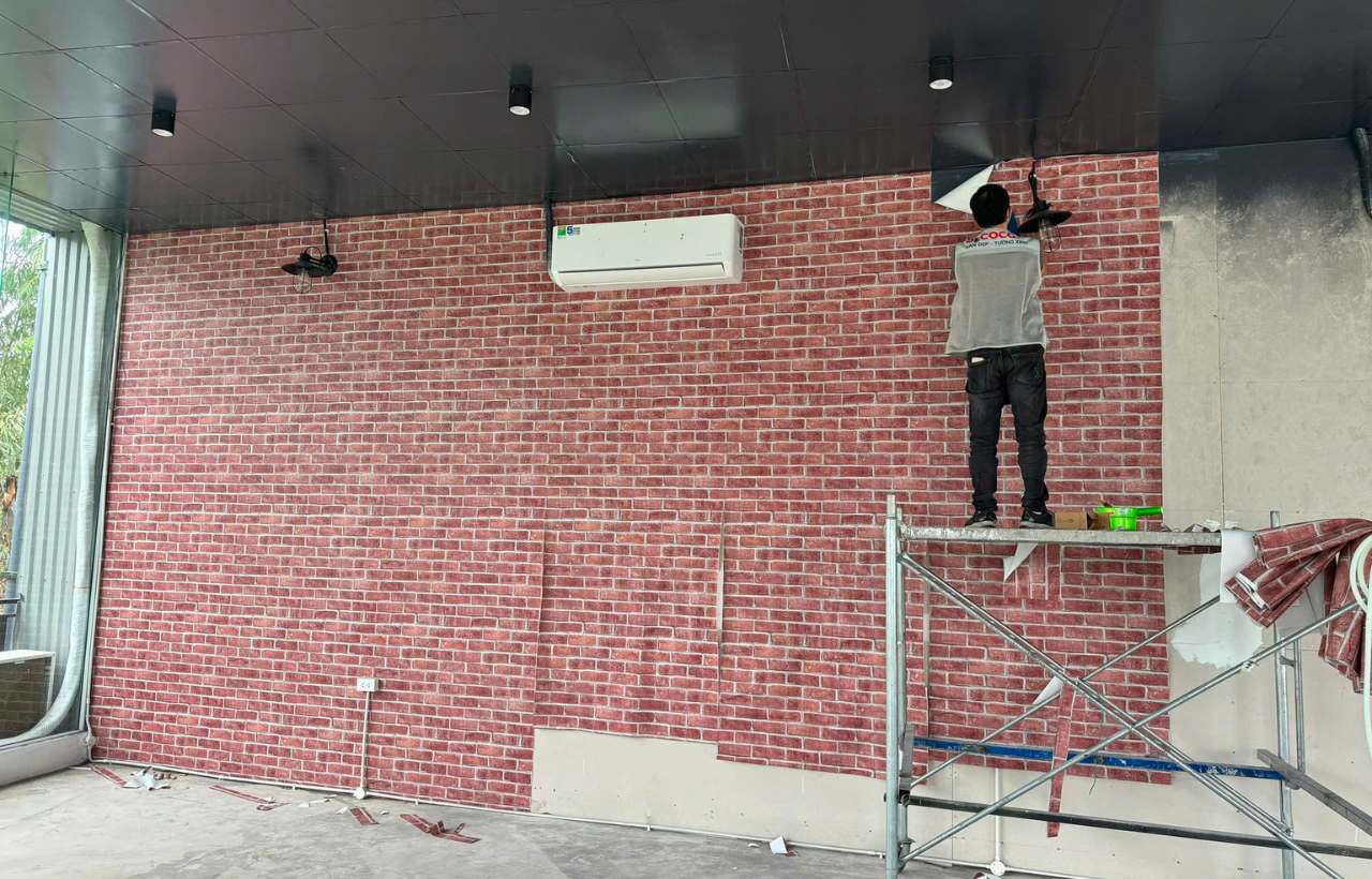 Wallpaper installation worker at apartment in Ba Dinh, Hanoi