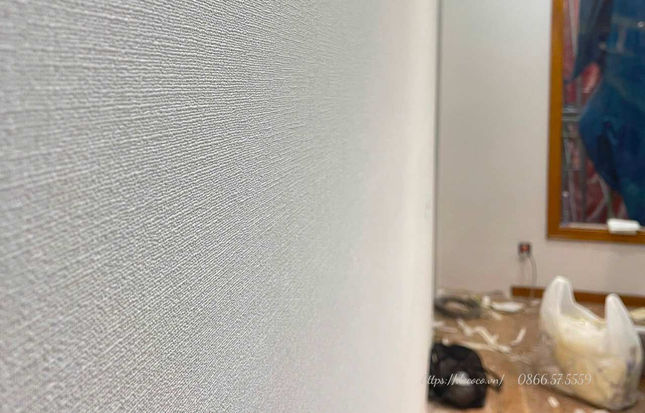 Textured fabric-style wallpaper for a modern apartment interior in Hanoi