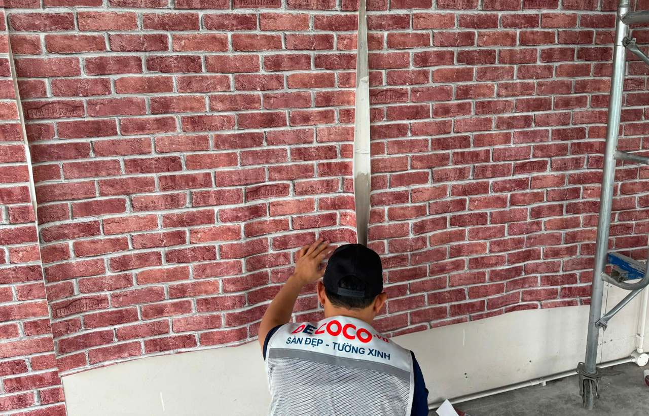 Brick wallpaper installation for cafe interior in Ho Chi Minh City