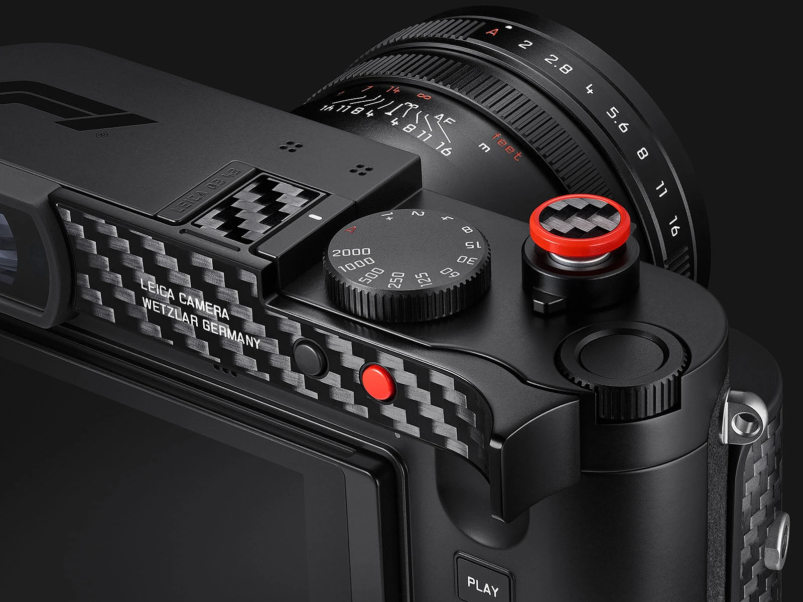 Cận cảnh vòng xoay tốc độ màn trập nút chụp viền đỏ và ống kính APO-Summicron