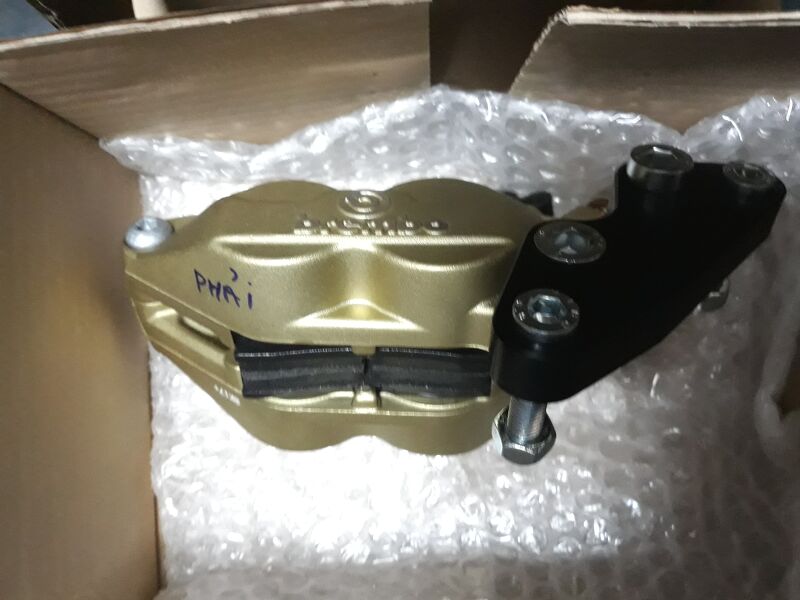 CỦ PHANH ĐẰNG TRƯỚC BÊN PHẢI 4 PITTONG HIỆU BREMBO LẮP T100 T120 - 2016 UP