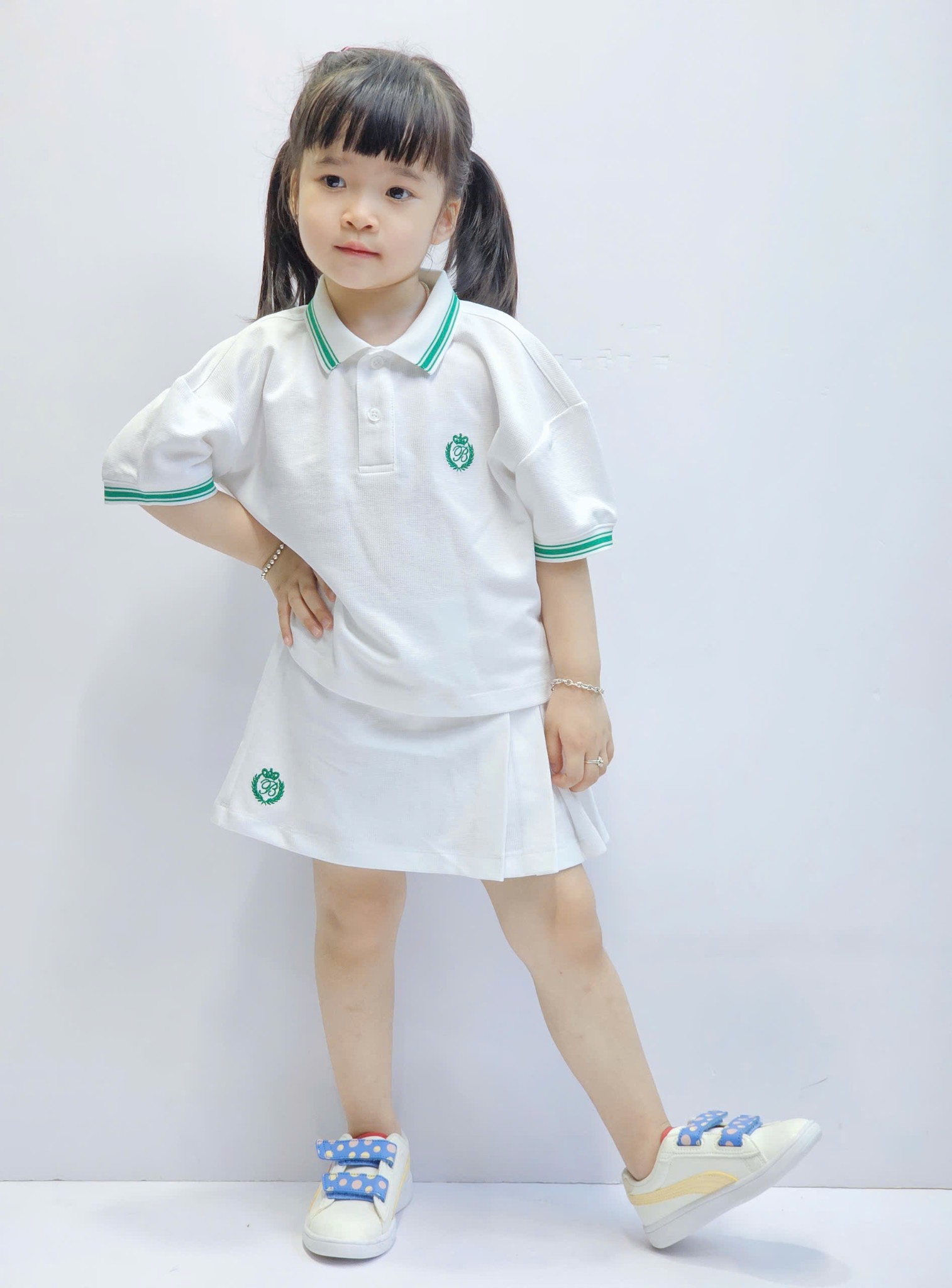 Sét cho bé gái, áo polo dáng lửng, chân váy có lớp lót quần, 2 màu