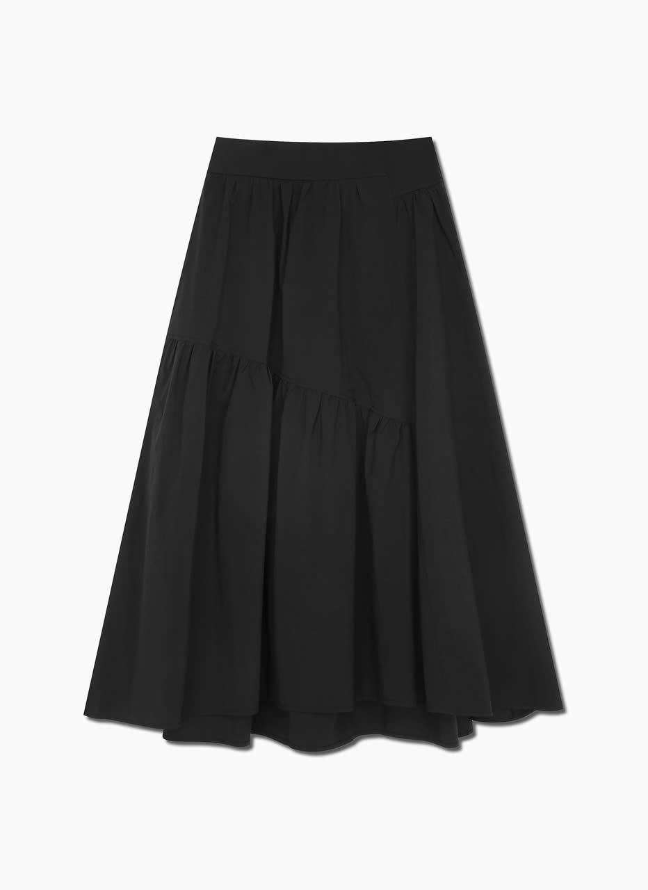 Chân váy midi xòe, bèo nhún không đối xứng