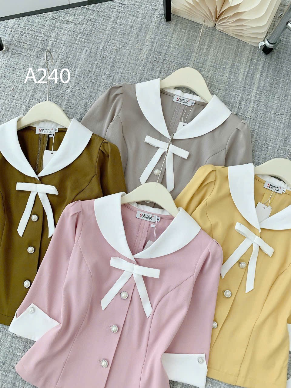 A240 Áo peplum cổ nơ trắng