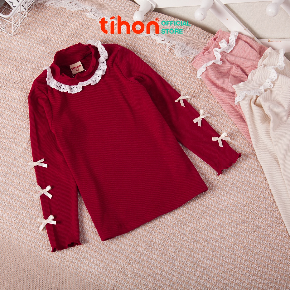 Áo bé gái giữ nhiệt tăm nơ trang trí 106