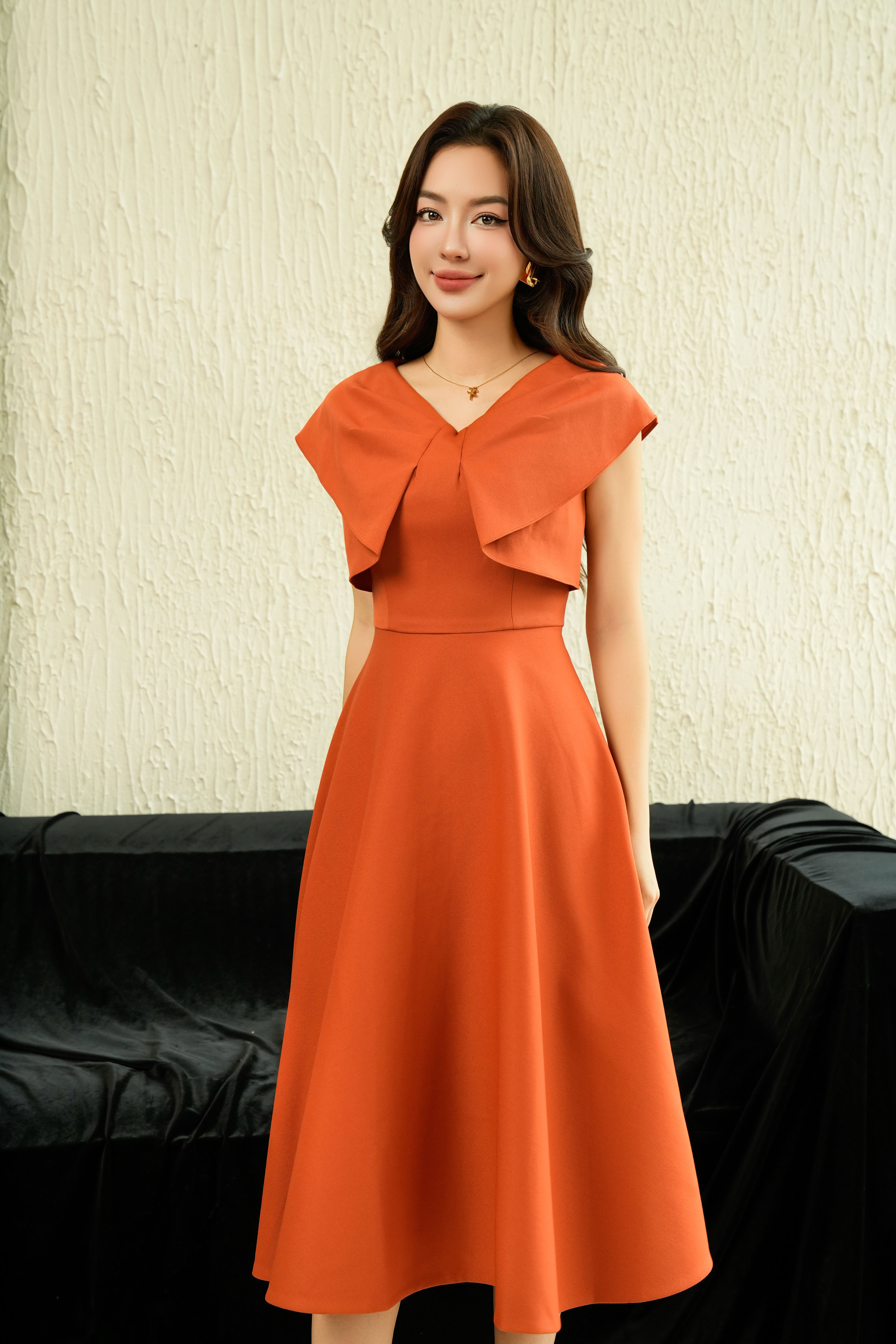 Đầm cam phối ngực Sixdo