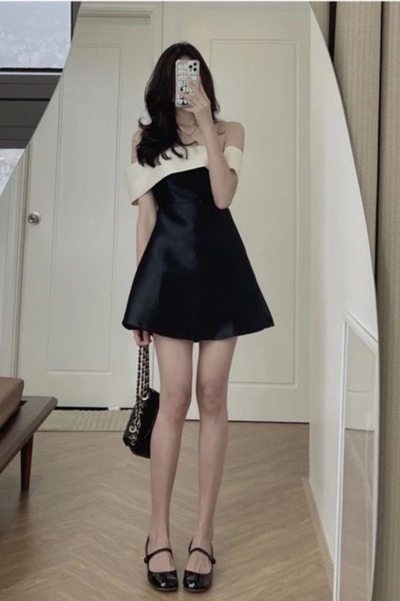 Đầm đen phối be trễ vai đính nơ