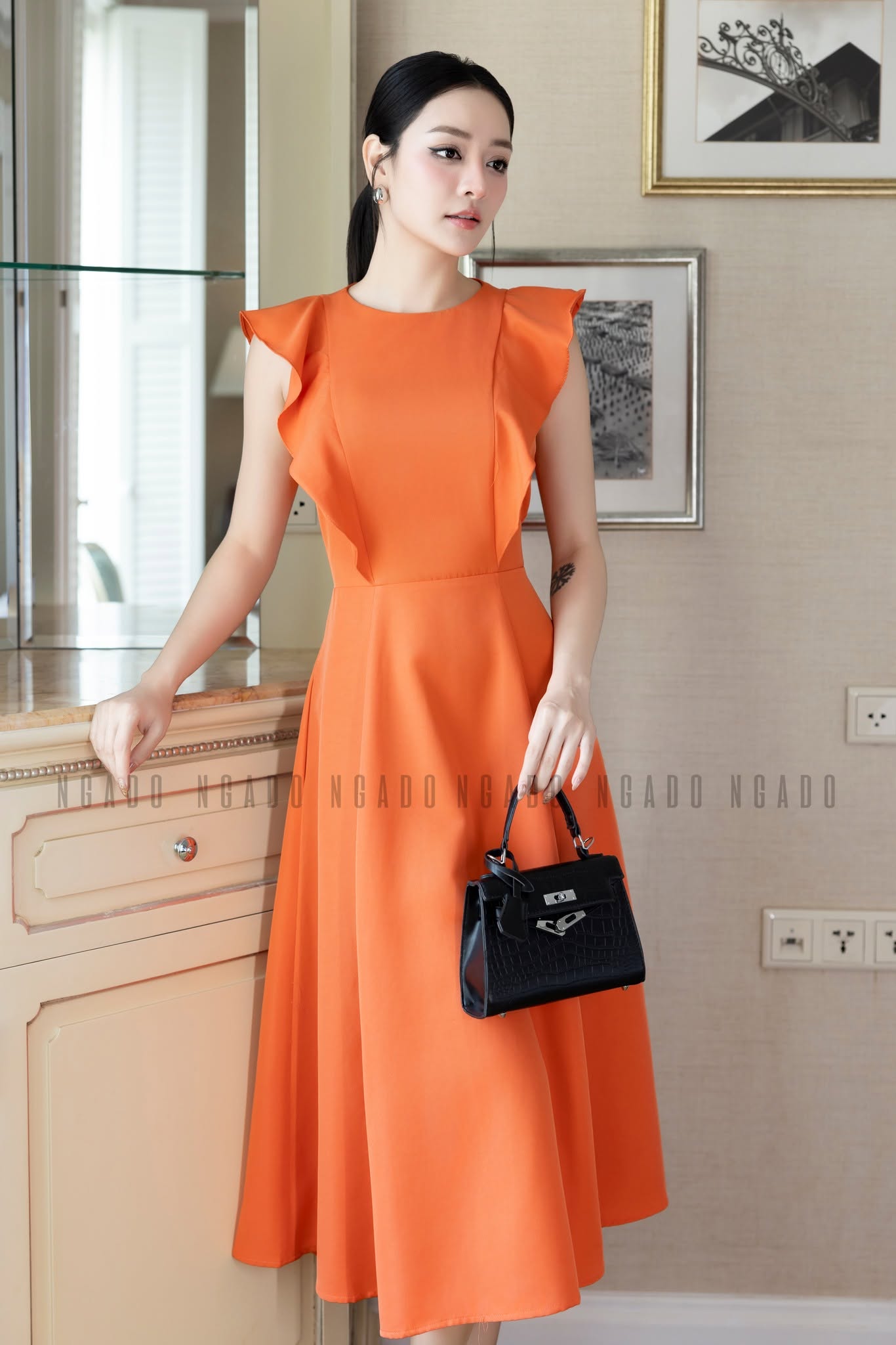 Đầm cam sát nách Ngado New Tags