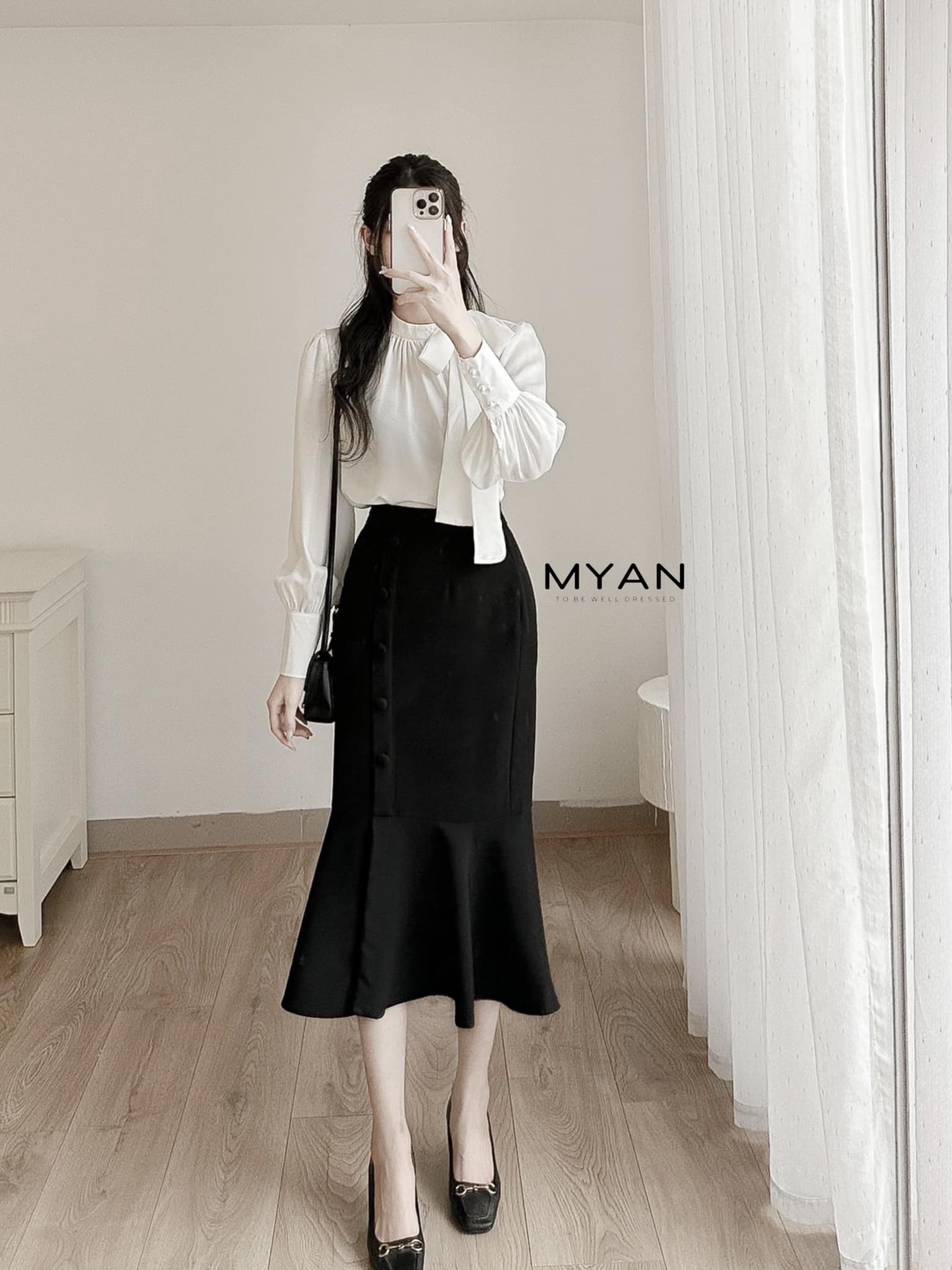 Chân váy đuôi cá hàng cúc giữa