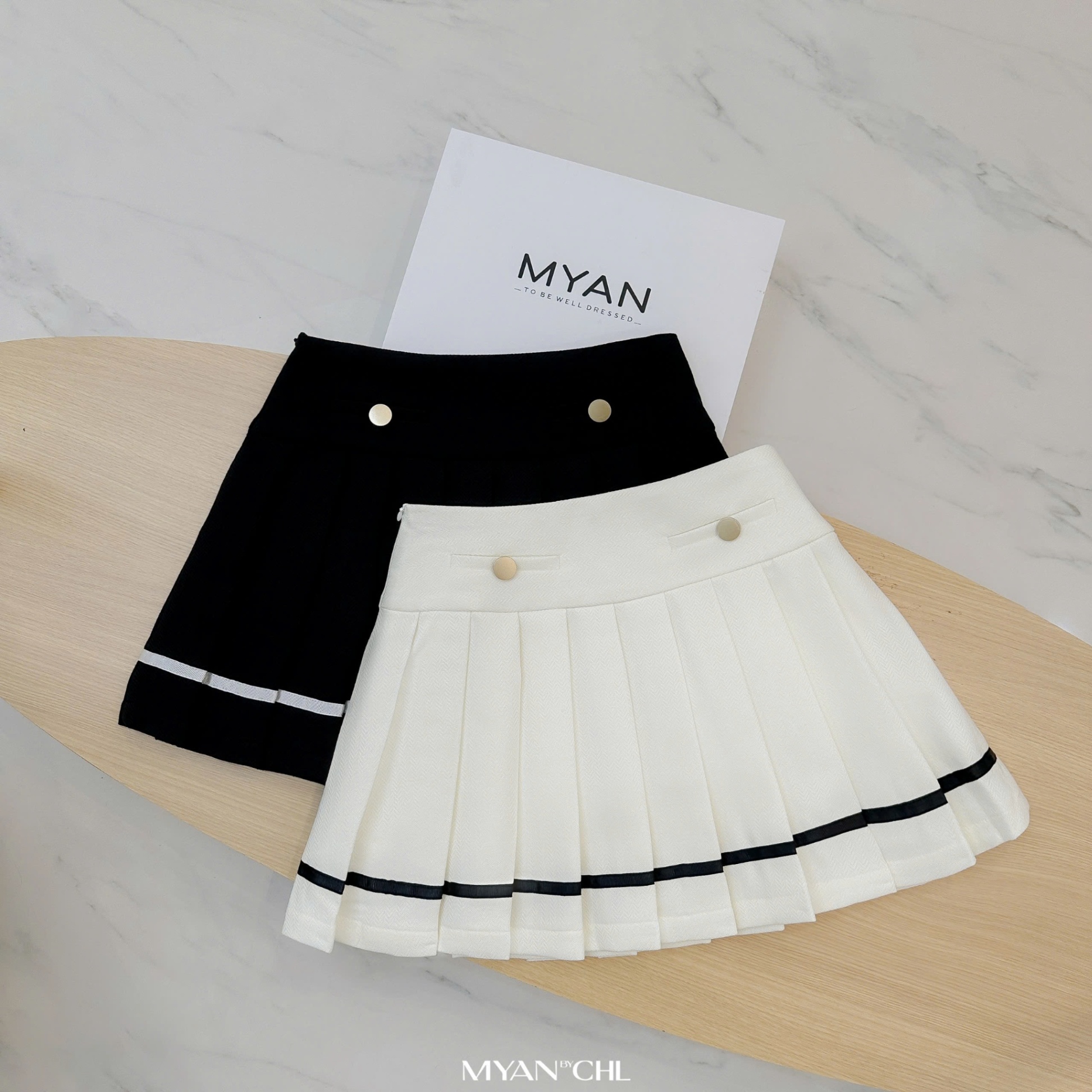 Chân váy xếp ly phối dây viền