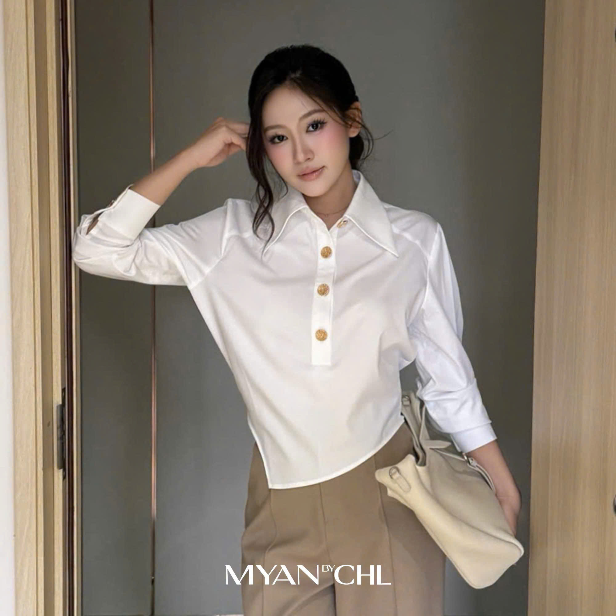 Áo sơ mi vạt gấu vát cài cúc kim loại