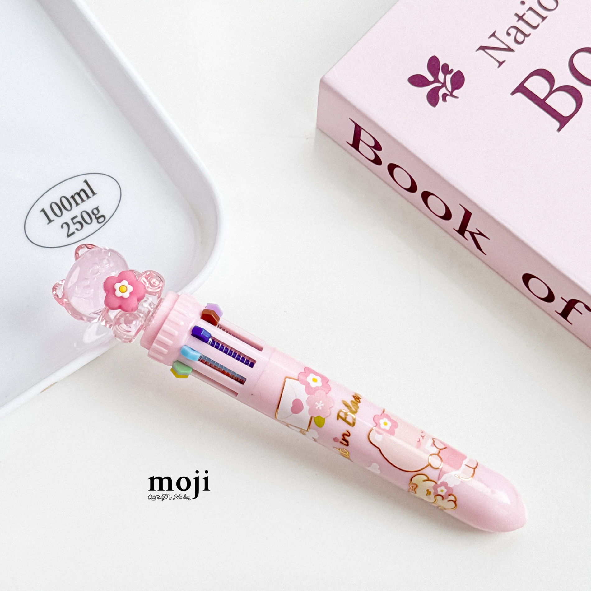 Bút viết bấm nhiều màu Cute cat ngồi trong suốt ôm hoa