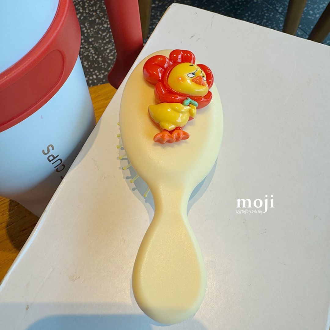Lược đệm mát xa Upset duck cosplay flower